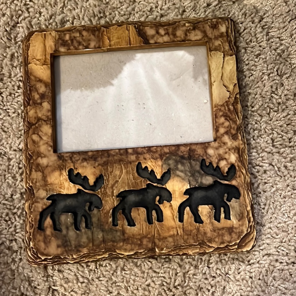 Moose picture holder. Hand carved 8in by 7 1/2in